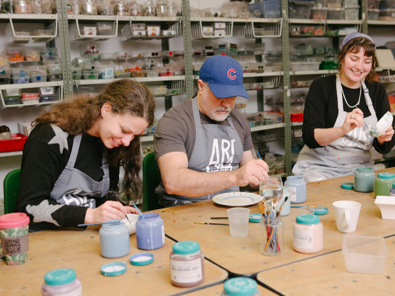 People painting pottery in London